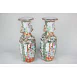 A pair of Chinese Cantonese porcelain vases, moulded with serpents and lions to neck and