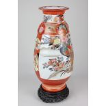 A Japanese Kutani porcelain vase decorated with a panel of geisha women with opposing panel of