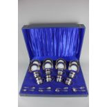 A silver mounted eight piece Rudolf Wachter porcelain coffee set of eight coffee cans with silver