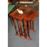 A 19th century nest of three rosewood rectangular occasional tables on turned supports, 51cm