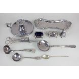 A pair of silver plated candle snuffers, scroll decorated tray, 25cm, a set of three cruets of