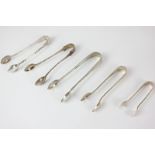 Five George V silver sugar tongs, makers including Pinder Brothers, Sheffield 1919, and John Rose,