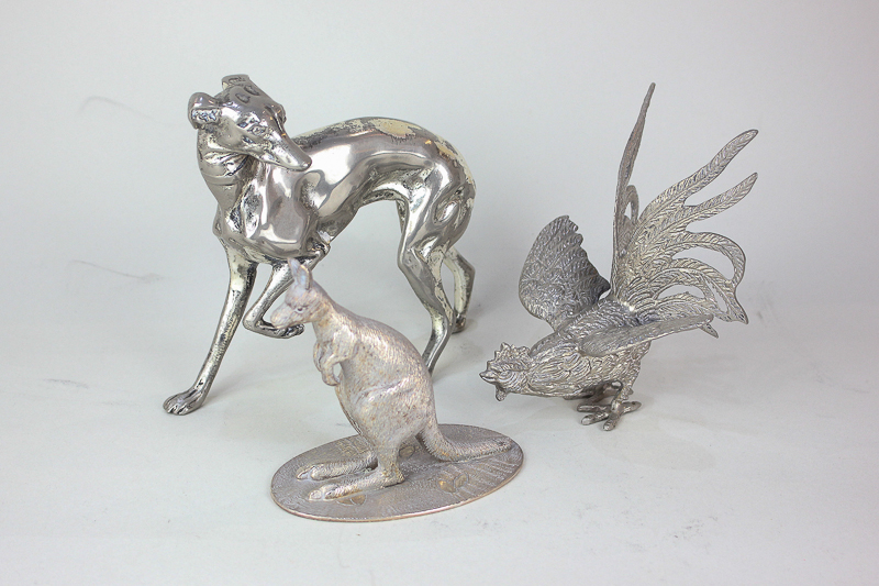 A silver plated model of a greyhound, 15cm, another of a kangaroo, and a model of a cockerel, 12cm