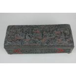 A Chinese cinnabar lacquer rectangular box, the hinged lid decorated in relief, with figures and