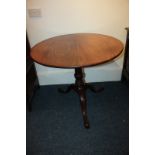 A 19th century mahogany occasional tripod table with circular tilt-top, on baluster turned stem