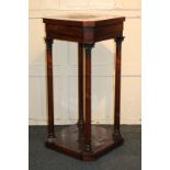 A 19th century rosewood plinth, the square top with canted corners, with four finely carved