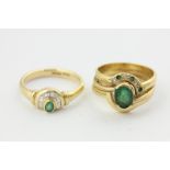 An emerald and diamond ring in 18ct gold, and another