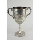 A Victorian silver two-handled cup with cast scroll handles, embossed floral bead and acanthus