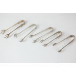 Five Edward VII silver sugar tongs with claw grips, makers including Hammond Creake & Co,