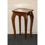 A kingwood parquetry ormolu mounted occasional table on slender cabriole legs to scrolled sabots,