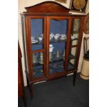 An Edwardian inlaid mahogany display cabinet with break-front central glazed door, domer surmount,