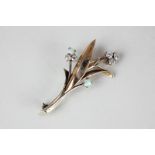 A diamond and opal floral spray brooch in yellow and white gold