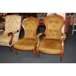 Two Victorian matching 'his' and 'hers' button upholstered fireside chairs with carved show wood