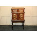 A Continental inlaid fruit wood cabinet, rising top with bone and mother of pearl scroll