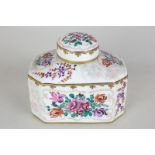 A Sampson porcelain octagonal tea caddy in the Chinese style with floral design, imitation character