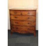 A George III mahogany bow-front chest of two short over three long drawers with brass drop