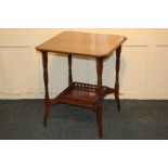 A Victorian mahogany side table, square top with canted corners and under-shelf with pierced