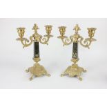 A pair of Louis XVI style gilt metal two-branch candelabra, two scroll branches with urn shaped