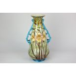 A Mintons Secessionist porcelain vase of baluster form with two sinuous blue foliate handles and