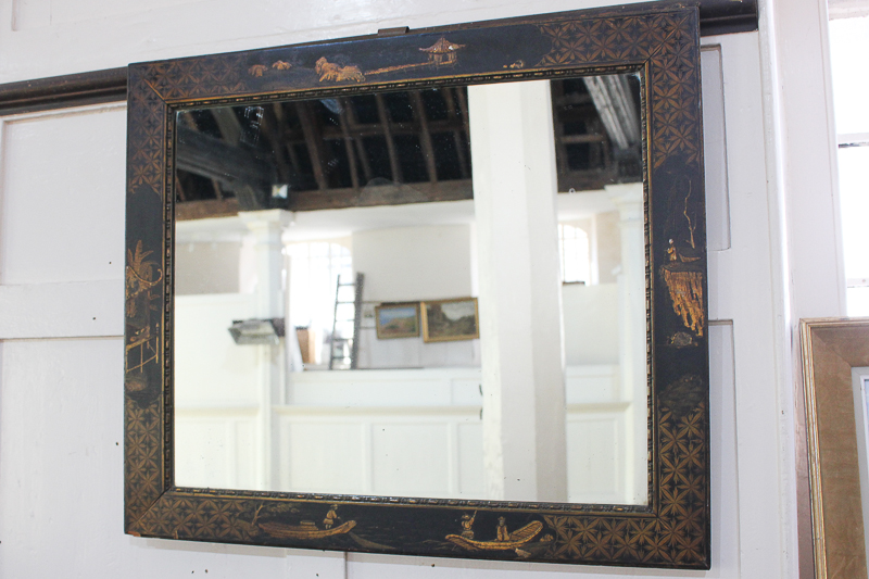 A Chinoiserie decorated black lacquered wall mirror, 58cm by 68cm