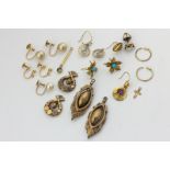 A pair of gold drop earrings, three other pairs of earrings, and a collection of single earrings