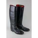 A pair of black leather riding boots, marked Rieker, size 7.5, with plastic boot stretchers, 49cm