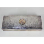 A Victorian silver dressing table box, rectangular shape with hammered effect hinged lid with
