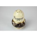 A MacIntyre Burslem pottery pepper pot, in the form of an acorn, with gilt and marbled brown border,