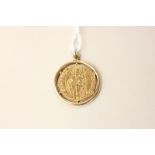 A gold pendant mounted with an ancient Roman coin