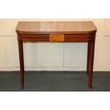 A 19th century inlaid mahogany tea table, with D shaped fold-over top, on square tapered legs and