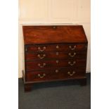 A George III mahogany bureau, with fall front enclosing fitted interior, with four graduated