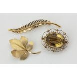 A 9ct gold and citrine brooch, an 18ct fern brooch, and a 9ct gold leaf brooch