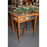 An Edwardian inlaid mahogany vitrine with rectangular glazed rising top and glazed sides, on