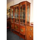 An Edwardian satinwood and Vernis Martin display cabinet, the moulded cornice and scroll painted