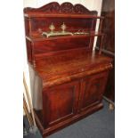 A Victorian mahogany chiffonnier with raised double shelf back, turned supports, frieze drawer and