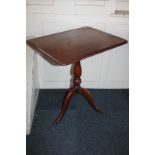 A rectangular mahogany tilt-top side table on baluster stem and three outswept legs, 60cm