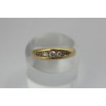 A diamond seven stone ring, the graduated stones in a 'pea pod' setting in 18ct gold