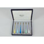 A cased set of six Danish silver gilt and harlequin enamel marrow scoop spoons, maker Egon