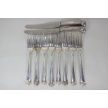 A matched set of eight George III silver Hanoverian pattern table forks including a set of four,