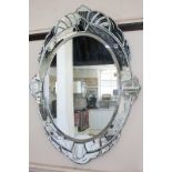 A Venetian style panelled oval wall mirror with floral decoration (a/f), 90cm by 66cm