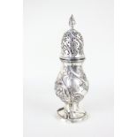 A large Continental silver sugar caster, the baluster body spiral fluted and chased with flowers and