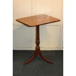 A small mahogany rectangular tilt-top side table with baluster turned stem on outswept tripod