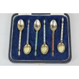 A cased set of six Norwegian silver gilt and harlequin enamel coffee spoons, maker Jacob Tostrup,