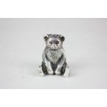 An Edward VII silver novelty pepper pot in the form of a seated teddy bear, maker J Gloster Ltd,