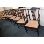 A set of seven George III style mahogany dining chairs including one carver, each with central