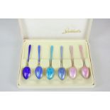 A cased set of six Norwegian silver gilt and harlequin coffee spoons stamped 925 S, the box marked