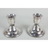 A pair of modern silver dwarf candlesticks with vase sconces on loaded circular bases, maker MC