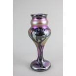 A Quezal iridescent glass vase with silver overlay in a floral design, etched mark to base, 19cm