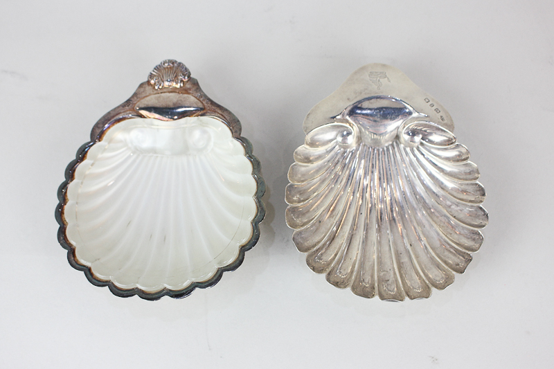 An Elizabeth II silver shell shaped butter dish with frosted glass liner, maker A Chick & Sons