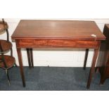 A Chippendale style mahogany tea table with fold-over rectangular top, on square tapered legs, 90cm